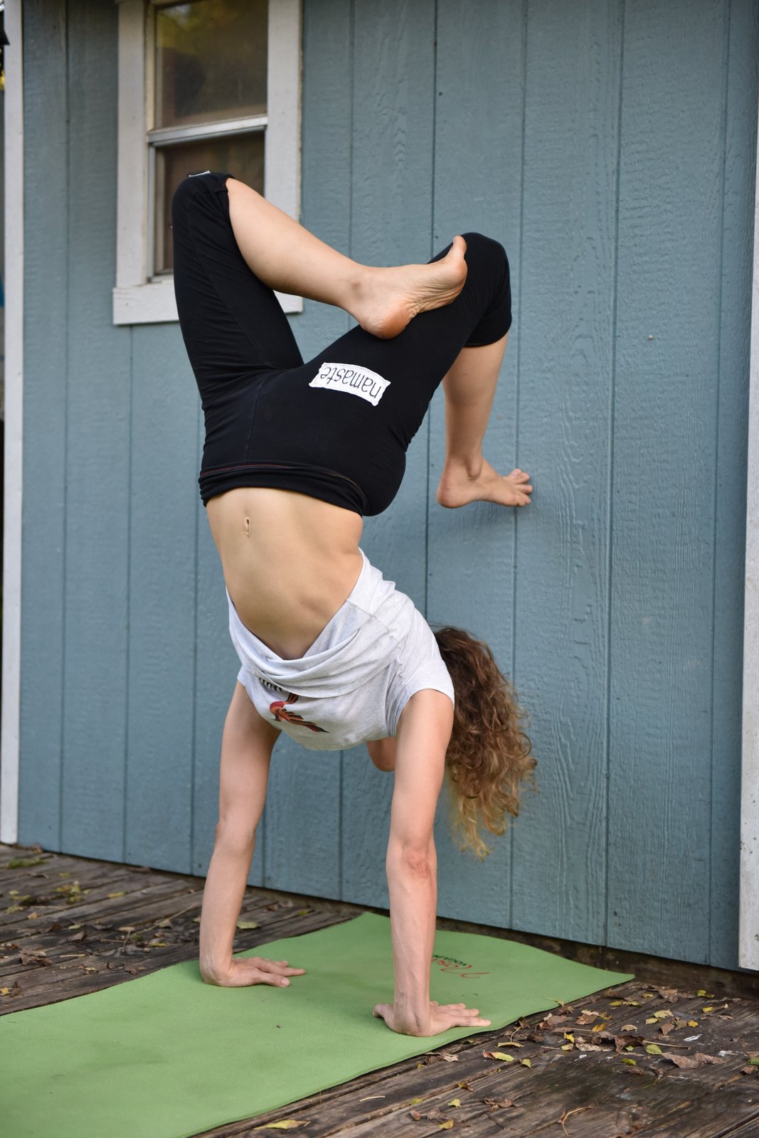 Young woman practicing yoga, Vrschikasana / Scorpion pose Stock Photo -  Alamy